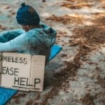 beggars-sitting-street-with-homeless-messages-please-help_1150-22968