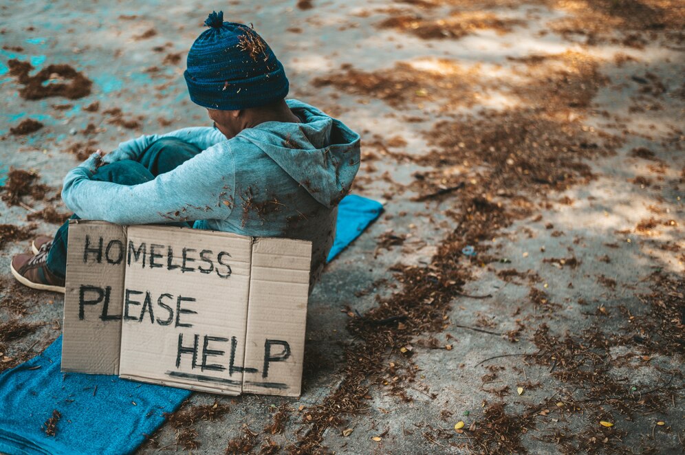 beggars-sitting-street-with-homeless-messages-please-help_1150-22968