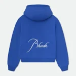 Rhude Clothing is a popular streetwear brand known for its stylish and modern designs. Founded by Rhuigi Villaseñor in 2015, the brand has quickly gained a strong following among fashion lovers, celebrities, and sneaker enthusiasts. With a blend of luxury and casual aesthetics, Rhude has become a go-to choice for those who want to stand out in street fashion. The Story Behind Rhude Clothing Rhuigi Villaseñor, the creative mind behind Rhude, was born in the Philippines and later moved to Los Angeles. His background and personal experiences have played a huge role in shaping the brand’s identity. With no formal fashion training, Villaseñor started designing clothes from his home, using inspiration from music, culture, and art. His breakthrough came when celebrities started wearing his designs, and Rhude quickly became a recognized name in the industry. The Style of Rhude Clothing Rhude Clothing is famous for its bold graphics, high-quality fabrics, and relaxed fits. The brand merges streetwear with luxury, creating pieces that feel both stylish and comfortable. The designs often mix vintage and modern aesthetics, giving them a timeless yet trendy appeal. Many of its pieces feature unique patterns, oversized silhouettes, and distressed details. This combination of elements makes Rhude a standout in the world of street fashion. Rhude’s clothing is also known for its muted color palettes, often using earth tones and neutral shades like beige, black, olive, and brown. These colors give a sophisticated and understated look while still maintaining a cool, streetwear edge. Popular Rhude Clothing Items Rhude offers a variety of clothing items that have become staples in the streetwear community. Some of the most well-known Rhude pieces include: T-Shirts Rhude t-shirts often feature eye-catching prints and logos. The brand frequently incorporates vintage-inspired graphics, giving the shirts a unique and nostalgic feel. Many of their designs include motorcycle or racing themes, reflecting Villaseñor’s love for car culture. Hoodies & Sweatshirts Rhude’s hoodies and sweatshirts are known for their oversized fit and premium materials. These pieces often include bold text, embroidered details, and minimalist designs, making them perfect for casual yet stylish outfits. Jackets Rhude jackets range from bomber jackets to workwear-inspired coats. They blend classic designs with modern twists, such as oversized fits, unique pocket placements, and high-end fabrics. These jackets are often priced higher due to their craftsmanship and premium materials. Shorts & Pants Rhude’s shorts and pants are some of the most iconic items in the brand’s lineup. Their Rhude Traxedo Shorts, for example, feature a track-pant-inspired look with drawstrings, side stripes, and a relaxed fit. These shorts have been worn by multiple celebrities and are highly sought after. The brand also offers stylish cargo pants, jeans, and sweatpants, often featuring relaxed fits and vintage-inspired designs. Sneakers & Footwear Rhude has collaborated with several major brands like Puma and Vans to release exclusive sneakers. These collaborations bring Rhude’s signature style to footwear, creating unique and limited-edition designs that sneakerheads love. Why Is Rhude Clothing So Popular? Rhude Clothing’s rise to fame can be attributed to several key factors: 1. Celebrity Endorsements Many celebrities, including Kendrick Lamar, LeBron James, and A$AP Rocky, have been seen wearing Rhude. This exposure has helped the brand gain a wider audience and solidify its reputation as a must-have streetwear label. 2. High-Quality Craftsmanship Rhude pieces are made from premium materials, making them more luxurious than typical streetwear brands. The high level of craftsmanship and attention to detail set Rhude apart from mass-produced clothing. 3. Limited Releases & Exclusivity Rhude frequently releases clothing in limited quantities, making certain items highly sought after. This scarcity creates demand, as fashion enthusiasts rush to grab pieces before they sell out. 4. Unique Aesthetic The combination of luxury, vintage, and streetwear influences gives Rhude a distinctive look that appeals to a wide range of fashion lovers. Whether it’s a t-shirt, hoodie, or pair of shorts, each Rhude piece carries a signature style that’s instantly recognizable. Rhude Collaborations & Partnerships Rhude has worked with several major brands and companies to create exclusive collections. Some notable collaborations include: Rhude x Puma – This collaboration brought Rhude’s bold design aesthetic to Puma sneakers and apparel, resulting in sleek and stylish footwear options. Rhude x Vans – Featuring unique designs and high-quality materials, Rhude’s Vans collab reimagined classic sneaker silhouettes with a fresh perspective. Rhude x McLaren – This collection showcased racing-inspired apparel, blending McLaren’s automotive heritage with Rhude’s streetwear sensibilities. These collaborations have further cemented Rhude’s reputation in the fashion industry, making it one of the most exciting streetwear brands to watch. Where to Buy Rhude Clothing Rhude Clothing is available at several high-end fashion retailers, both online and in-store. Some of the best places to shop for Rhude include: Official Rhude Website – The best place to find the latest collections and exclusive releases. Luxury Retailers – Stores like SSENSE, Farfetch, and Mr Porter often carry Rhude’s latest drops. Streetwear Boutiques – Select boutiques specialize in high-end streetwear and may have limited Rhude pieces available. Resale Marketplaces – Due to its limited releases, many Rhude items can be found on platforms like Grailed, StockX, and GOAT. Rhude Clothing Pricing & Value Rhude is considered a high-end streetwear brand, so its pricing reflects its premium quality. Expect to pay: $150 – $300 for t-shirts $300 – $600 for hoodies & sweatshirts $500 – $1,500 for jackets $300 – $700 for pants & shorts $150 – $500 for sneakers While the prices may be steep, many fashion enthusiasts believe Rhude’s craftsmanship and exclusivity make it worth the investment. Final Thoughts Rhude Clothing has made a significant impact on the streetwear industry with its unique blend of luxury, vintage, and casual aesthetics. With high-profile celebrity endorsements, limited-edition releases, and collaborations with major brands, Rhude continues to grow as a leading name in fashion. For those who appreciate quality and standout designs, Rhude Clothing is a brand worth exploring. Whether you’re looking for a statement piece or a stylish everyday outfit, Rhude offers something for every streetwear lover.