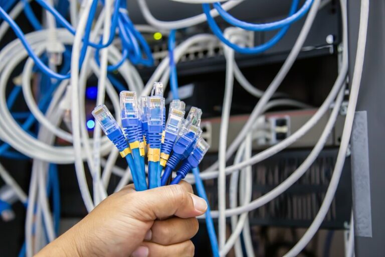 close-up-hand-choose-many-lan-network-cable_101448-2905