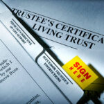 "Sign Here" tab on living trust documents