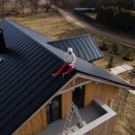 long-shot-man-with-helmet-sitting-roof_23-2149343711