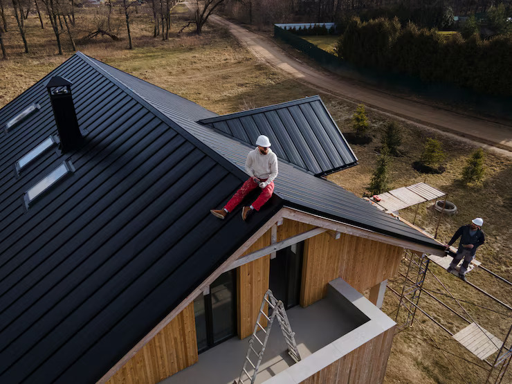 long-shot-man-with-helmet-sitting-roof_23-2149343711