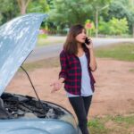 young-woman-with-car-breaks-down-she-is-calling-emergency-services_1150-1516