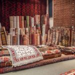 Variety of the gorgeous oriental carpets in traditional carpet store in Middle East