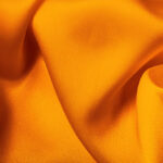 Orange yellow satin fabric for background use.More satin backgrounds