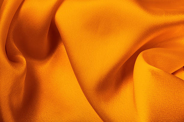 Orange yellow satin fabric for background use.More satin backgrounds