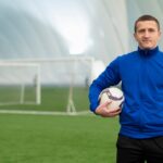 medium-shot-man-holding-ball_23-2149271024