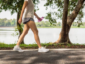 01-woman-walking-benefits-of-walking-everyday-woman-walking-on-path-770
