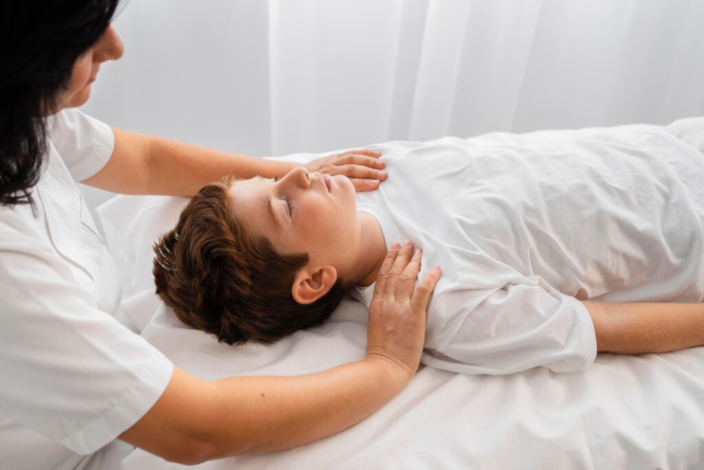 female-osteopathist-treating-kid-hospital (1)