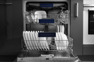 An open dishwasher with plates and glasses