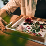 person-hands-flowers-framing-shop-with-sustainability-work-floral-job-decoration-table-business-owner-plants-frame-desk-store-with-leaf-art-design-with-wood-retail-scaled