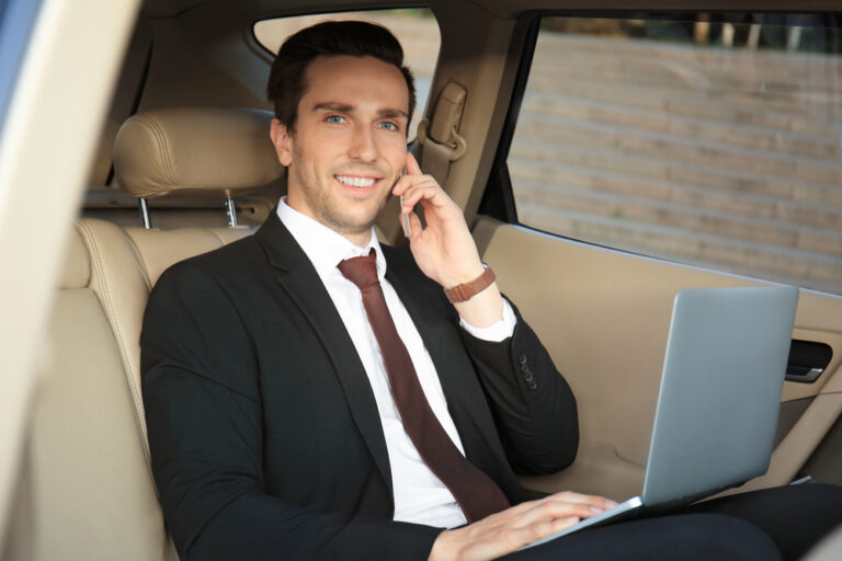 Man,In,Formal,Wear,With,Laptop,Talking,On,Phone,In