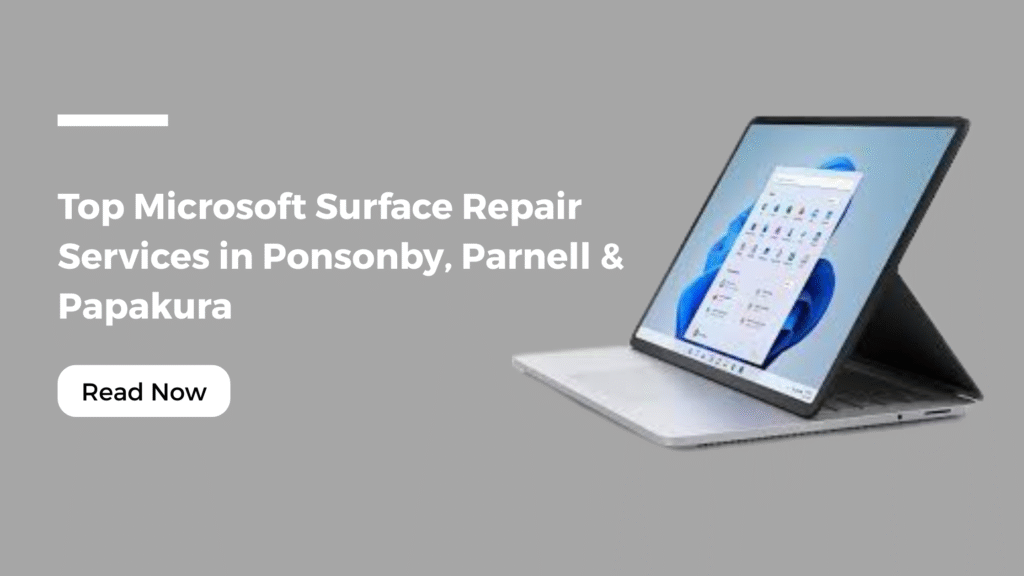 A Microsoft Surface laptop displayed on a grey background with text reading “Top Microsoft Surface Repair Services in Ponsonby, Parnell & Papakura” and a “Read Now” button – promoting Smashed It repair services in Auckland.