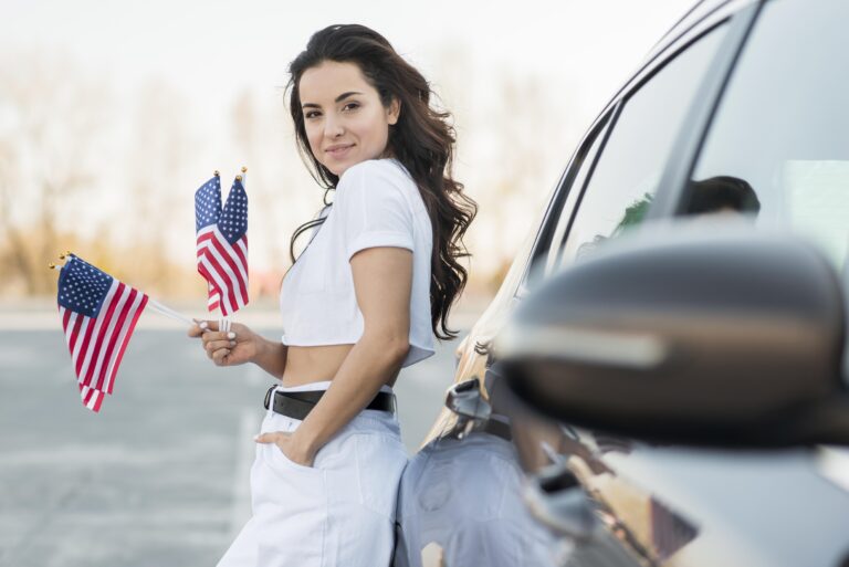 mid-shot-brunette-woman-holding-usa-flags-near-car