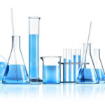 Test-tubes with reflections on a colored background. Laboratory glassware.