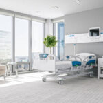Interior of a modern luxury hospital room with city view.