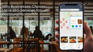 Smartphone displaying ‘restaurants near me’ search results on a map inside a busy restaurant, illustrating local SEO services for restaurants.