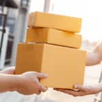 service-delivery-concept-man-holding-600nw-2585111111