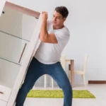 How Do Experts Safely Move Heavy Furniture Items?