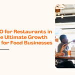 Waiter serving customers in a modern restaurant showcasing local SEO for restaurants in 2026 to increase dine-in traffic and Google Maps rankings.