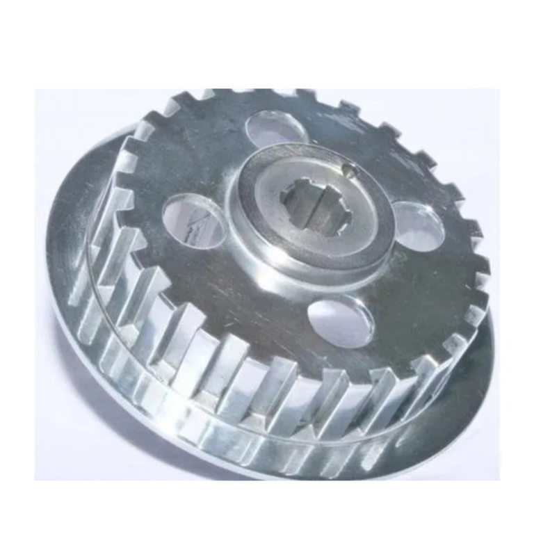 Close-up of a circular metal gear with teeth around the edge and a splined center hole.