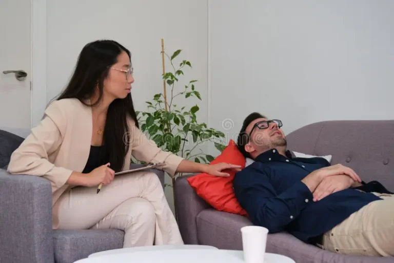 asian-female-psychologist-comforting-her-caucasian-man-patient-therapy-men-mental-health-concept-233054198