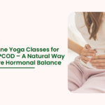 Woman holding her lower abdomen with PCOS pain concept – best online yoga classes for PCOS and PCOD hormonal balance.