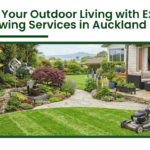 Professional lawn mowing services in Auckland creating a lush green garden with a landscaped backyard and a man mowing the lawn