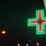 sign of pharmacy in night street