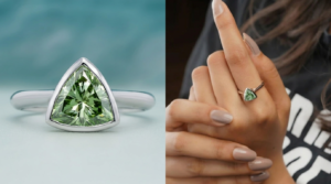 Lab grown green diamond engagement ring with trillion cut green stone in a white gold band worn on a woman’s hand