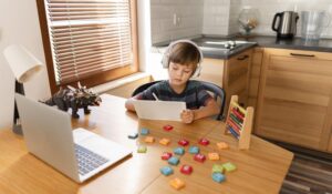 long-shot-child-attending-virtual-school-courses