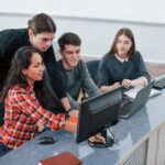 Look at this. Group of young people in casual clothes working in the modern office
