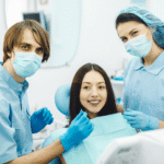 smiling-dentists-before-checking-patient (1)