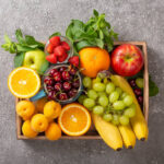 Set of summer fruits and berries in wooden serving.