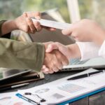 business-people-shaking-hands-finishing-up-meeting_1150-37745