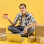 smiley-delivery-man-with-packages-beside