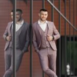 imgi_16_smartly-dressed-businessman-modern-businessman-confident-young-man-full-suit-standing-outdoors-with-building-background-scaled