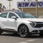 kia-sportage-2026-white-beige-front-left-angle-876x535