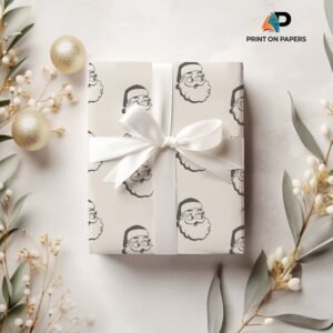 Elegant custom Christmas wrapping paper featuring black and white Santa Claus designs, finished with a white ribbon and bow.